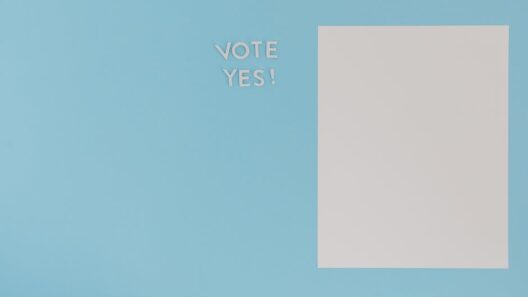 A minimalist concept image featuring 'Vote Yes' text and blank paper on a blue background.