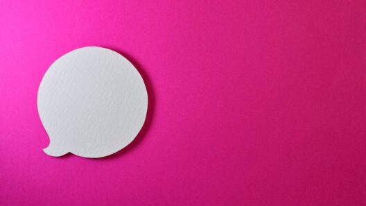 Minimalist pink background with a white speech bubble for creative design projects.