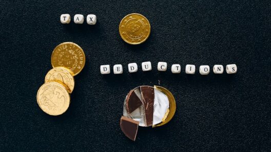 Creative concept of tax deductions using chocolate coins and letter tiles on a black background.